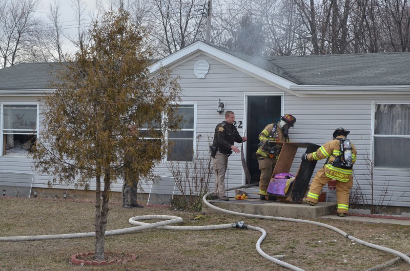 Fire broke out just after 5 p.m. in a home at 1522 Dot St., Warsaw. (Photos by Stacey Page)