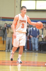 Senior Jared Bloom brings the ball up the floor versus Concord. Bloom led the Tigers with 14 points in their triple overtime win in the sectional semifinal.