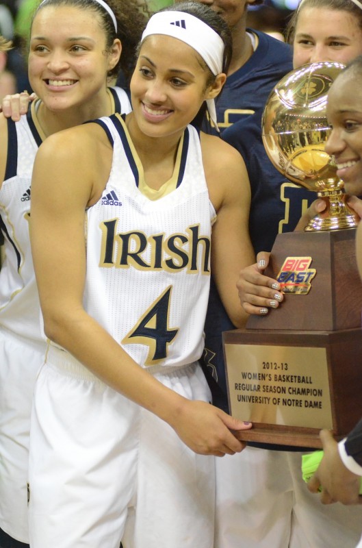 Notre Dame senior Skylar Diggins is all smiles while holding the Big East Conference championship trophy Monday night after a home win over UConn.