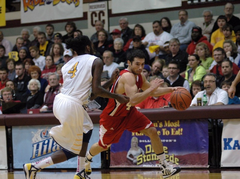 Grace College senior guard Bruce Grimm Jr. drives past a defender during action Monday night. The Lancers lost 79-58 to No. 1 William Penn in a semifinal game of the NAIA National Championships (Photo provided by Grace College Sports Information Department)