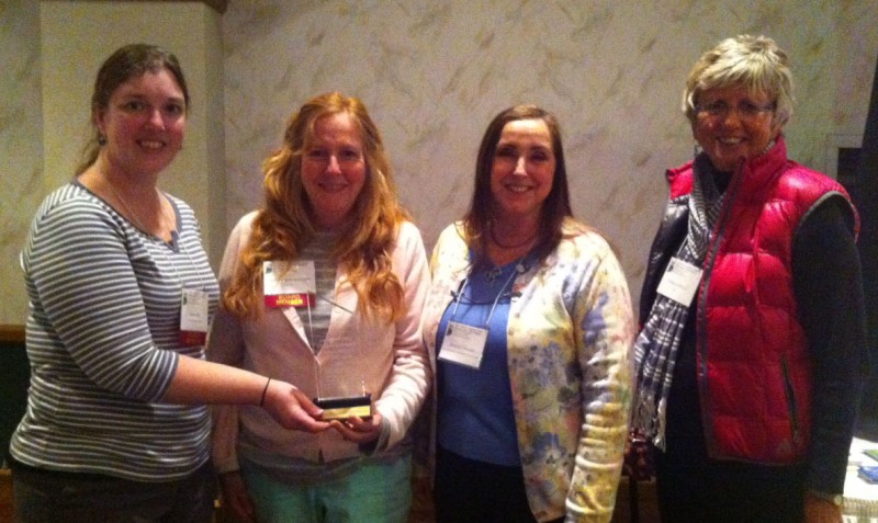 Indiana Lakes Management Society President Sara Peel, left, presents the 2013 Outstanding Lake/Watershed Association of the Year Award to, from left, Heather Hardwood, Joanne Moore, WACF Ecology Committee and Diana Castell, board member, at the annual ILMS Annual conference. (Photo provided)