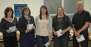 From left are Nanchy Rehling, sixth grade science teacher representing Wawasee Middle School; Kris Woodard, principal at North Webster Elementary; Wawasee High School student Sara Christner, representing the Key Club; Cindy Kaiser, principal at Milford School; and Jim Garner, principal at Syracuse Elementary. WHS Key Club donated magazine vouchers to each of the four school libraries during Tuesday’s school board meeting. (Photo by Tim Ashley)