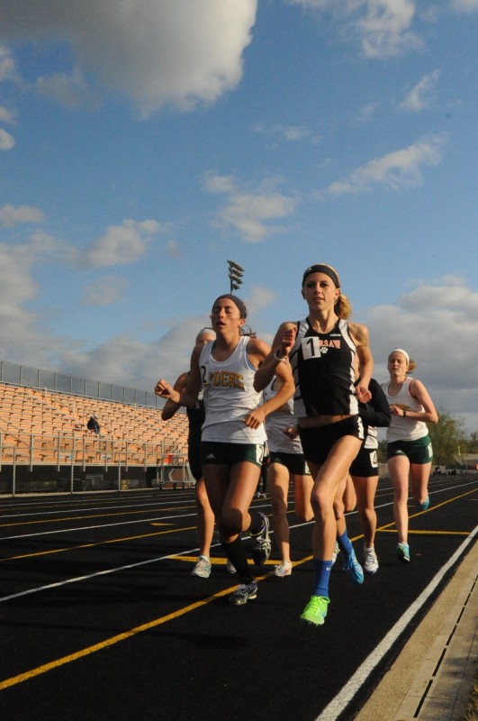 Warsaw star runner Ashley Erba leads the pack in a race during her junior track season in 2012. Erba is currently sidelined due to three foot fractures (Photo by Mike Deak)