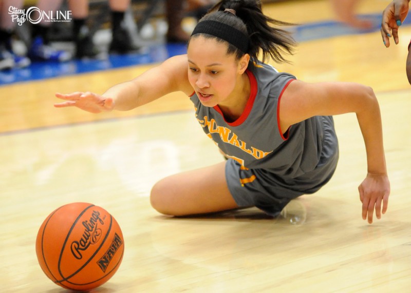 Warsaw senior Jennifer Walker-Crawford dives for a loose ball during All-Star game action Monday night at Bethel College. The standout scored a game-high 16 points to help her team to a 76-66 victory (Photos by Mike Deak)