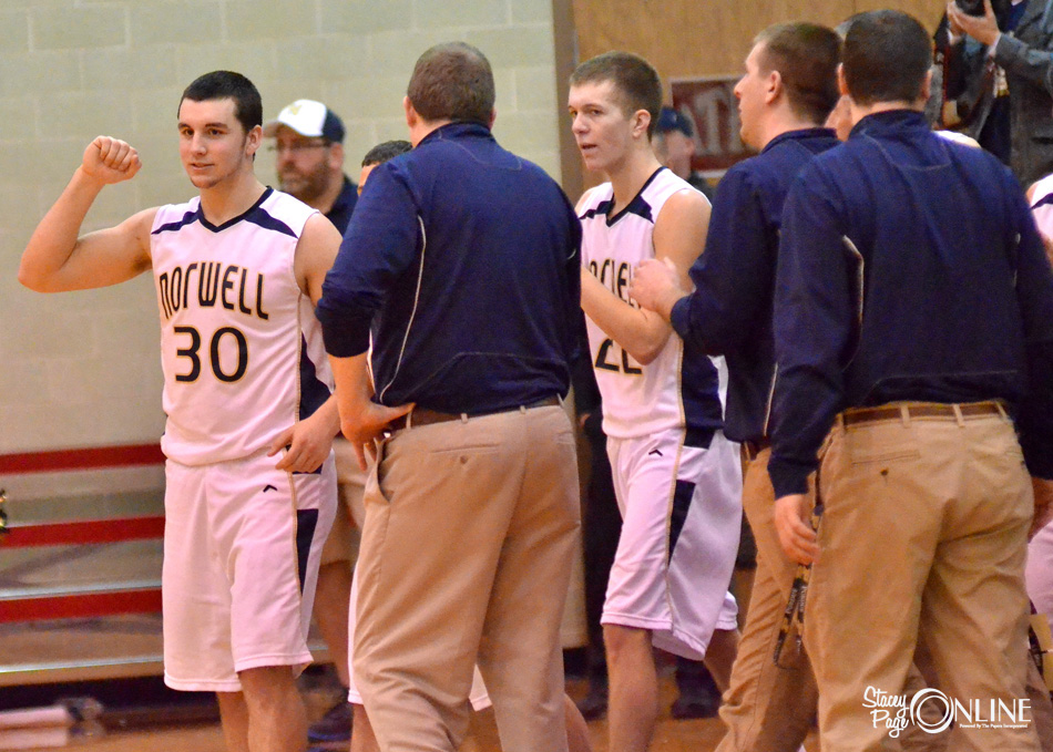 Norwell's Piercen Harnish (30) and David Vogel (22) lead the Knights off the bench after knocking Tippecanoe Valley from the Blackford Regional.