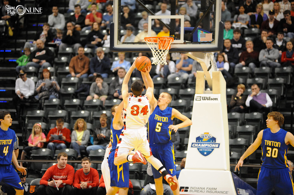 Clay Yeo blocks the shot of Borden forward Cody Bachman during the first half of the IHSAA Class 1-A Boys Basketball State Championship. (Photos by Mike Deak)