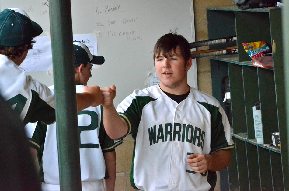 Nate Prescott of Wawasee receives congratulations after getting a hit against Concord. (Photos by Nick Goralczyk)