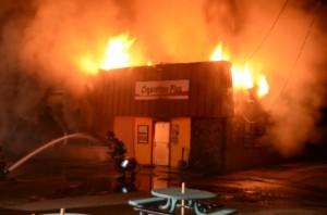 Cigarettes Plus, in the 800 block of North Lake Street, Warsaw,  caught fire at about 3:50 a.m. Sunday morning. (Photo by Stacey Page)