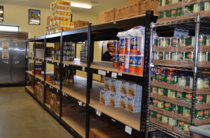 Prior to today's food drive by Lakeland Christian Academy, the food pantry at Combined Community Services was looking pretty bare. (Photo by Stacey Page)