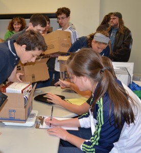 Students of Lakeland Christian Academy worked hard Wednesday during the school's fifth annual food drive for Combined Community Services. (Photo by Stacey Page)