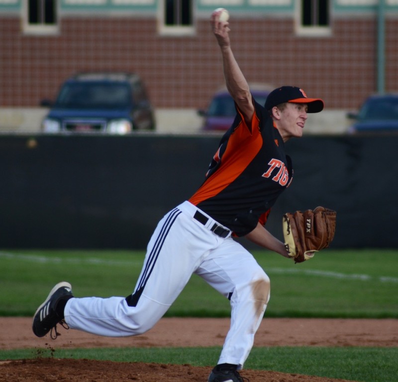 Jason Ferguson fires a pitch for Warsaw Monday night. The senior was outstanding with a three-hitter in a 10-0 home win over Elkhart Memorial.