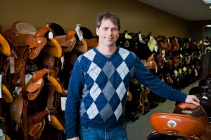 Chuck Klockow, president of Horse Saddle Shop, poses in the saddle showroom in Bremen where over 200 saddles and more than 1,500 pairs of boots are on display in their newly expanded store. Since 2000, HSS sold over 18,000 saddles and are the nation’s No. 1 dealer of U.S. made western saddles.
