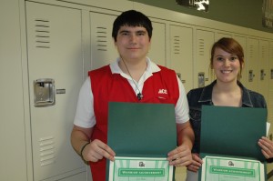 Jon Ruiz, left, and Sara Christner, Wawasee High School students, are shown with the certificates of recognition they received during Tuesday’s school board meeting. The two are members of the Key Club, which placed first at the district convention in Bloomington in the video competition and also the Single Service Award for the Stuff the Bus project. (Photo by Tim Ashley)
