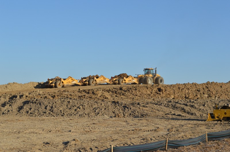 Buffers are under construction at the Trupointe site north of Milford. When completed they will offer a 15- to 20-foot barrier between the firm’s business area and the houses to the east of the property. The fertilizer and agronomy hub is set to open in the spring of 2014. (Photo by Deb Patterson) 