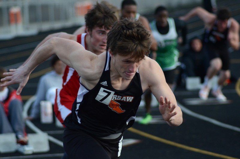 Warsaw's Nathan Kolbe bolts out to a victory in the 200 dash Thursday night. The No. 6 Tigers topped Plymouth and Concord easily to remain undefeated in the NLC (Photos by Jim Harris)