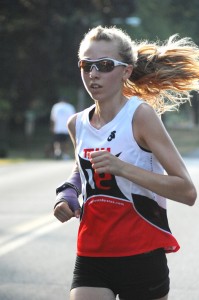 Maddie Woods motors to a championship run in the women's 8-mile run at the 2012 Flotilla Road Race. (Photo by Mike Deak)