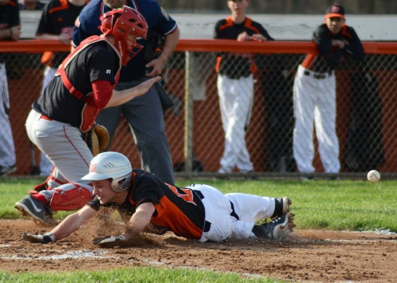 Brandon Shipp scores one of his three runs for Warsaw during a 10-0 NLC win over Elkhart Memorial Monday night (Photos by Jim Harris)
