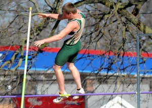 Kevin Carpenter clears the bar in the pole vault.