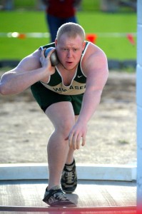 Chad Eppley prepares to throw the shot put during his winning round at Goshen.