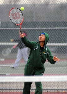 Wawasee's Priscilla Par battles rain drops to serve against Concord.