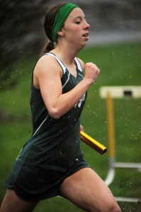 Wawasee senior Jan Slabaugh makes a dash for the line during the rainy 4x400 relay.