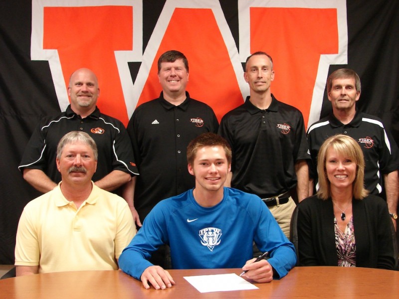 Warsaw senior Jared Bloom will continue his hoops career at IPFW as a preferred walk-on. Bloom, in the middle of the front row,  is flanked by his parents Larry and LaDonna above. In back  (from left) are WCHS Athletic Director Dave Anson, WCHS boys basketball coach Doug Ogle and WCHS assistant coaches David Wayne and Hal Gunter (Photo provided)