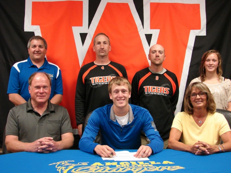 Warsaw senior Jason Ferguson will continue his baseball career at Ancilla College. Ferguson is shown above in front flanked by his parents Bruce and Sandy. In back are Ancilla coach Joe Yonto, WCHS head coach Mike Hepler, WCHS assistant coach Nate Howett and Jackie Ferguson (Photo provided)