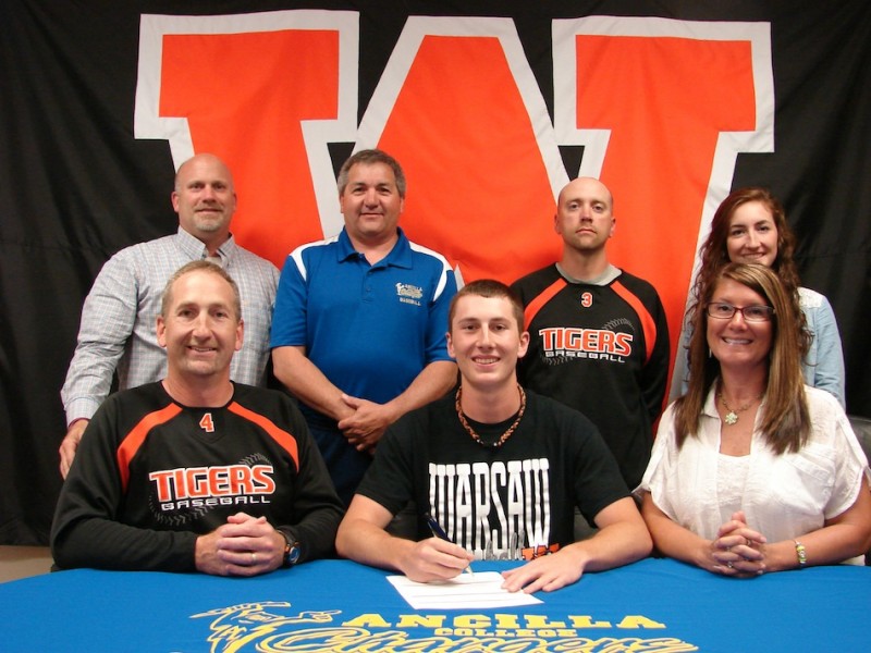 Warsaw senior Shay Hepler will play baseball at Ancilla College. Hepler is shown above in front flanked by his parents Mike and Taryn. In back are WCHS Athletic Director Dave Anson, Ancilla coach Joe Yonto, WCHS assistant coach Nate Howett and Alexis Hepler (Photo provided)