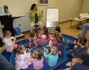 Youth Services Librarian Pam Long (aka Mrs. Pam) leads the children in a finger play at last winter’s Preschool Story Time. Registration for the summer session of Preschool Story Time begins Tuesday, May 28. (Photo provided)