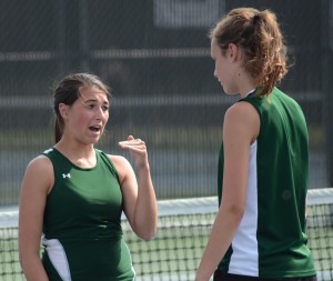 Wawasee's Jada Antonides and Sam Prins talk things over during a break in their No. 1 doubles match Friday night.