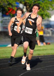 Gabe Furnivall and teammate Chad Goon make the final turn in the 400-meter run.