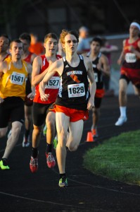 Warsaw's Robert Murphy leads the cavalcade around the turn during the 800-meter run. (Photos by Mike Deak)