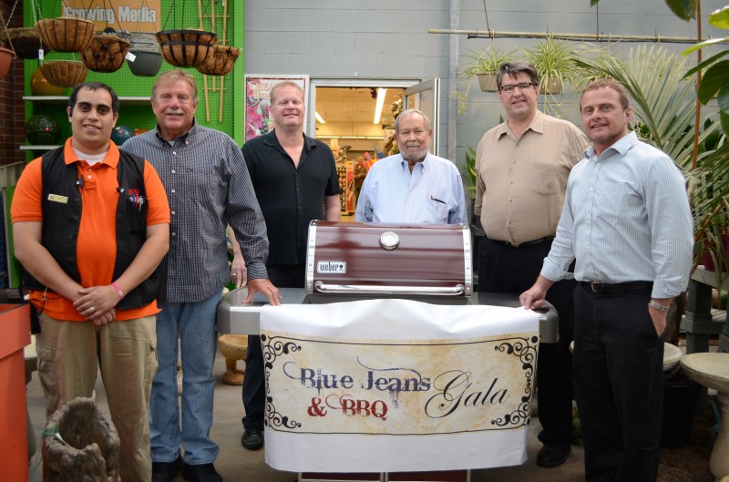 Ace Hardware of Warsaw has donated a Weber Genesis special edition grill for the silent auction that is part of the annual Blue Jeans and BBQ Gala to benefit Combined Community Services. From left are Josh Lainez of Ace Hardware; Jerry Ouding of The Spice Merchants and Olive Branch; John Tucker, Dane Miller and Gordy Clemens, celebrity chefs for the BBQ event; and Steve Possell, executive director of CCS. (Photo by Stacey Page)