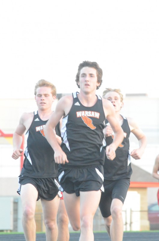 Warsaw distance star Ellis Coon leads the pack in the 3,200 early on Wednesday night (Photo by Scott Davidson) 