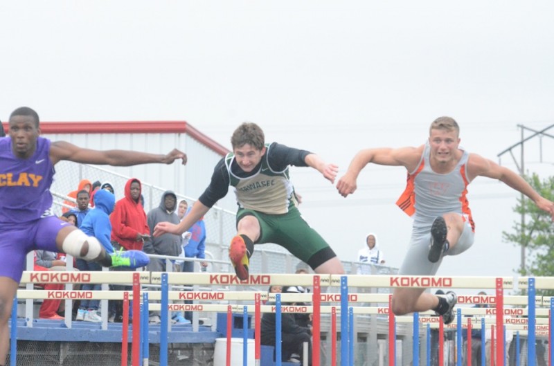 Wawasee sophomore Clayton Cook heads to a second-place finish in the 110 hurdles at the Kokomo Regional Thursday night. At right is Warsaw senior Taylor Cone, who placed third in the event. Both Cook and Cone advance to the State Finals June 1 (Photo by Scott Davidson)