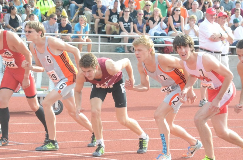 Warsaw senior stars Jake Poyner and Robert Murphy  prepare for the start of the 1,600 at the State Finals Friday night. The duo placed third and fourth respectively in the race to help the Tigers to a fifth-place team finish (Photos by Scott Davidson)
