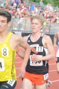Jake Poyner races to a fifth-place finish in the 3,200 at the State Finals Friday night in Bloomington.