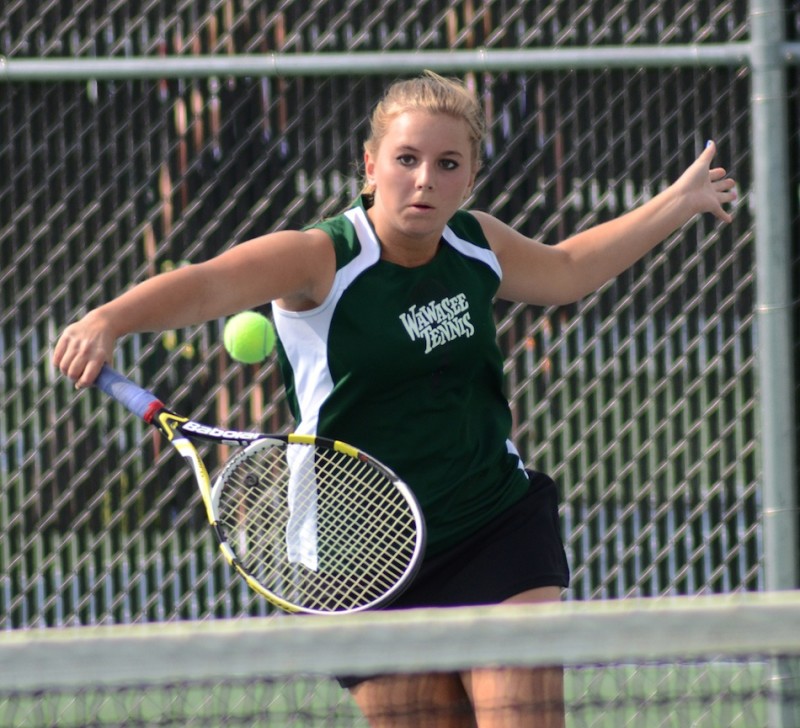 Esther Hermann of Wawasee makes a return during her victory at No. 1 singles in the sectional final at Warsaw Friday night.