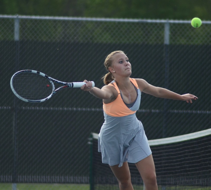 Camille Kerlin reaches for a shot for Warsaw Wednesday. Kerlin and Rosie Fleming were the heroes with the clinching point at No. 2 doubles in a 3-2 sectional win for the host Tigers (Photos by Jim Harris)