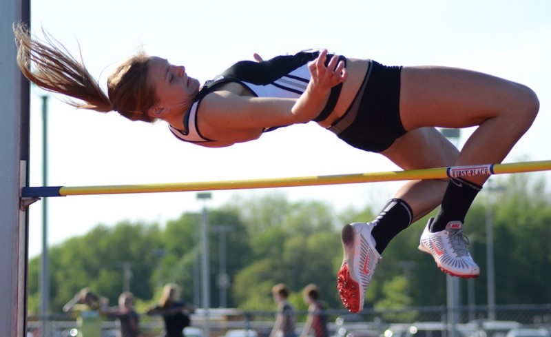 Senior Jamie Lacheta soared to a sectional championship in the high jump for Warsaw Tuesday night (Photos by Jim Harris)