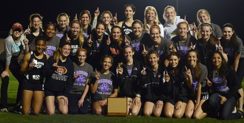 The Warsaw girls track team is all smiles after dominating the NLC Championships Tuesday night.