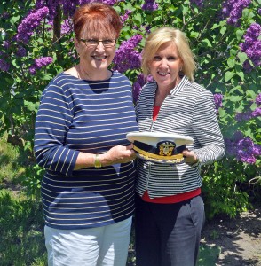 Kay Young receives the official Wawasee Flotilla commodore's hat from Holly Tuttle, flotilla committee chairwoman
