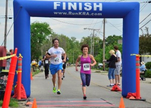 Yuko Baumann of Goshen was the overall women's winner, shown crossing the finish line with Joe Griner of North Webster.