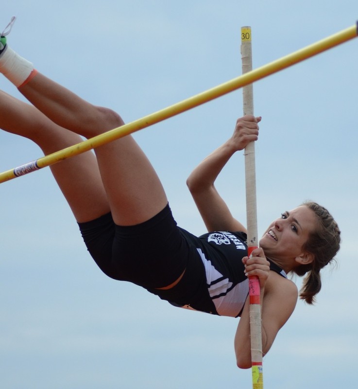 Megan Dearlove, shown during the NLC Meet last week, will be a key performer for Warsaw in the sectional Tuesday night. Dearlove won her second NLC title with a personal best performance of 10-4 in the pole vault (File photos by Jim Harris)