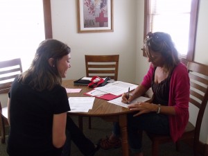 Ashlyn Fawley (left), Kosciusko Red Cross AmeriCorp member assisting Susanne Siebrase with deployment paperwork. (photo provided)