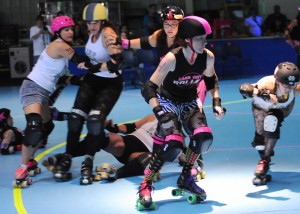 Flew The Coop, center, and the Lake City Roller Dolls will host the Region Rats on June 1 at Eastlake Skate Center in Warsaw. (File photo by Mike Deak)