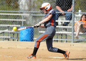 Kara Dishman of Warsaw makes solid contact early in the ballgame.