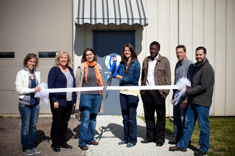 Present for the Hither & Yon grand opening were, from left, Jamie Koser, mission coordinator Mission Point Community Church; Lori Widman, volunteer and construction coordinator; Laurie Victa, marketing coordinator; Melissa Simfukwe, project manager; Kondo Simfukwe, lead pastor MPCC; Jeff Pritchard, display coordinator; and Abe Hepler, executive pastor MPCC.  Not pictured are Susan Grill, whose donated inventory inspired Hither & Yon, and Heather Marshall, owner of Nest Furniture & Design, who generously donated the store space. (Photo provided)