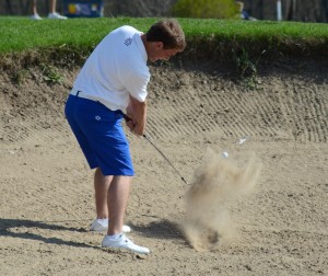 Ryan Rapp blasts out of the sand for Triton Wednesday. Rapp shot a 75 as the Trojans captured third place.