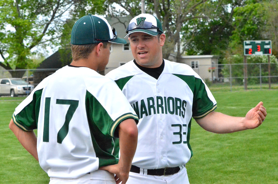 Wawasee head coach discusses matters with Drew Anderson during their game against NorthWood Monday night. (Photos by Nick Goralczyk)